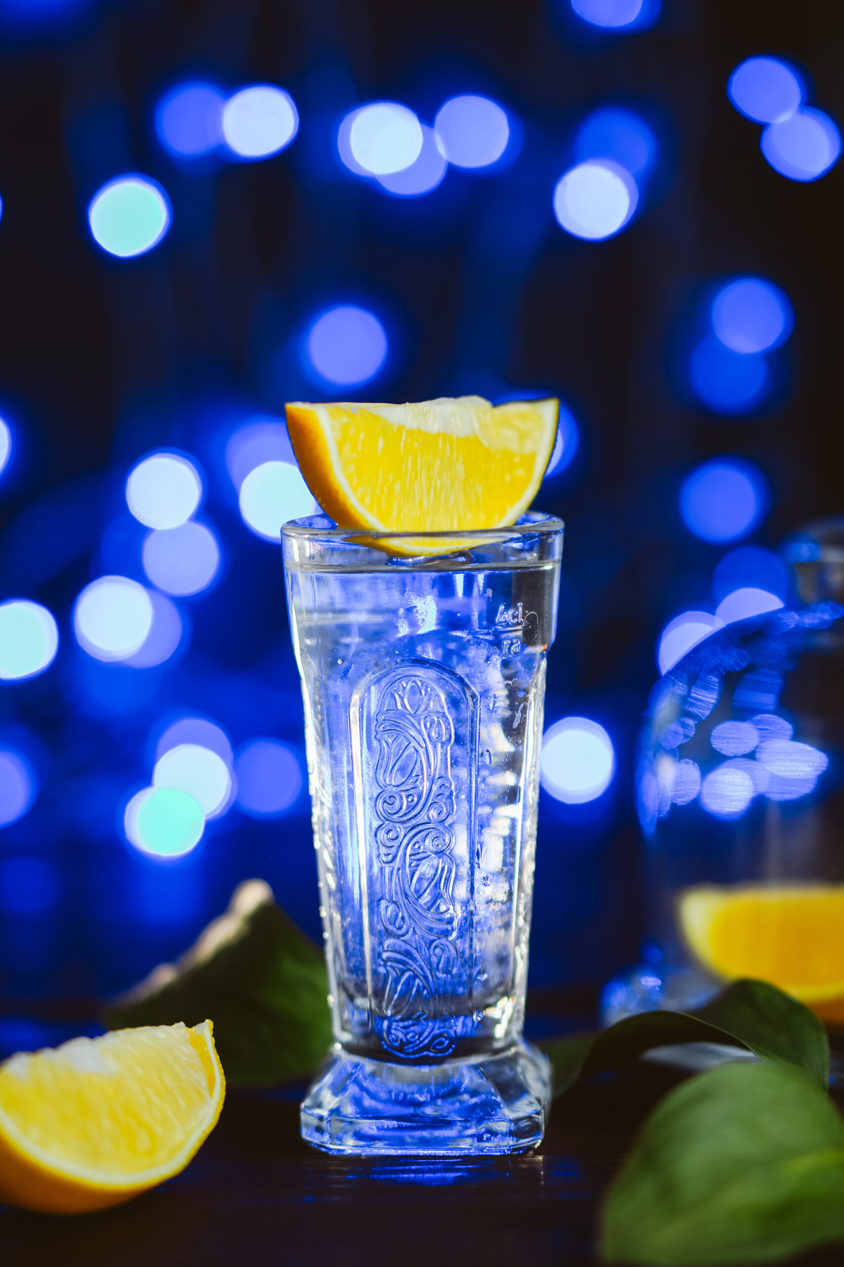 strong-alcohol-cocktail-with-lemon-jar-glass-dark-blue-background-studio-shot-drink